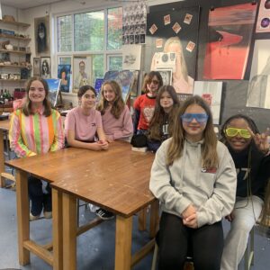 senior girls in neon and funny glasses